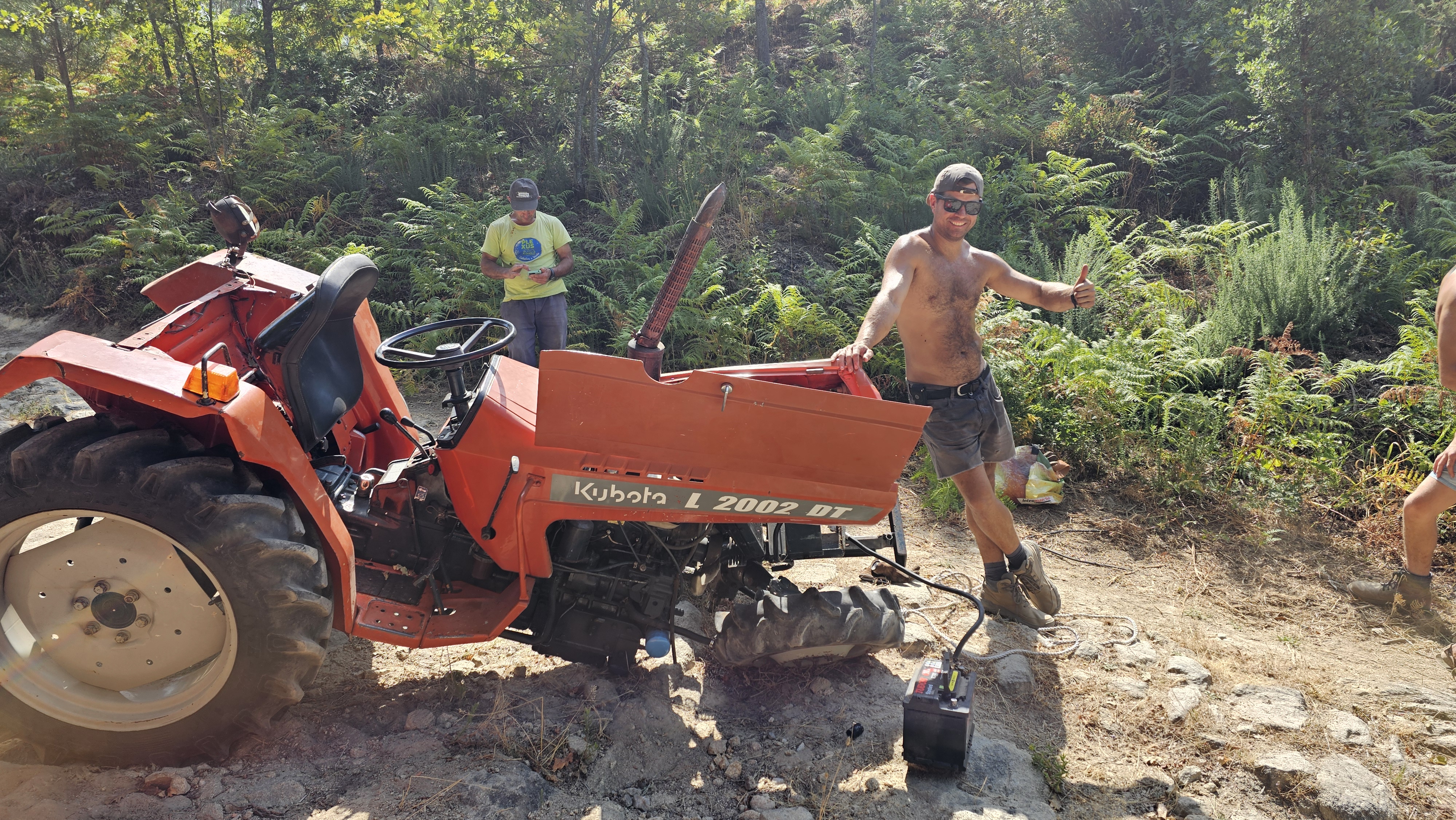 The broken tractor being prepared for removal